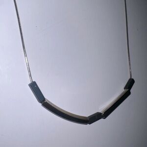 Silver adjustable 20-22 1/2” necklace with black & gold movable floating bars
